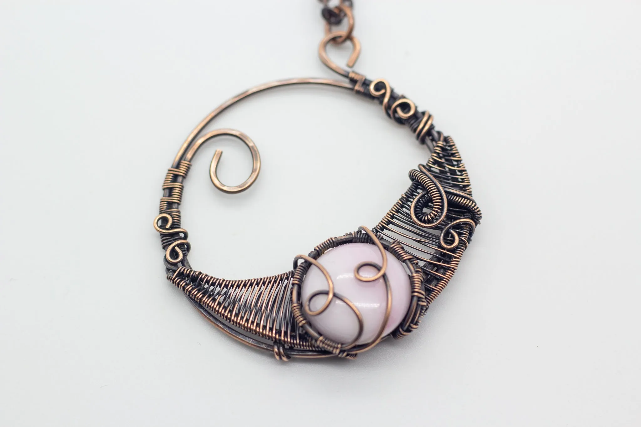Circular Copper Wire Wrapped Pendant with Light Pink Fused Glass