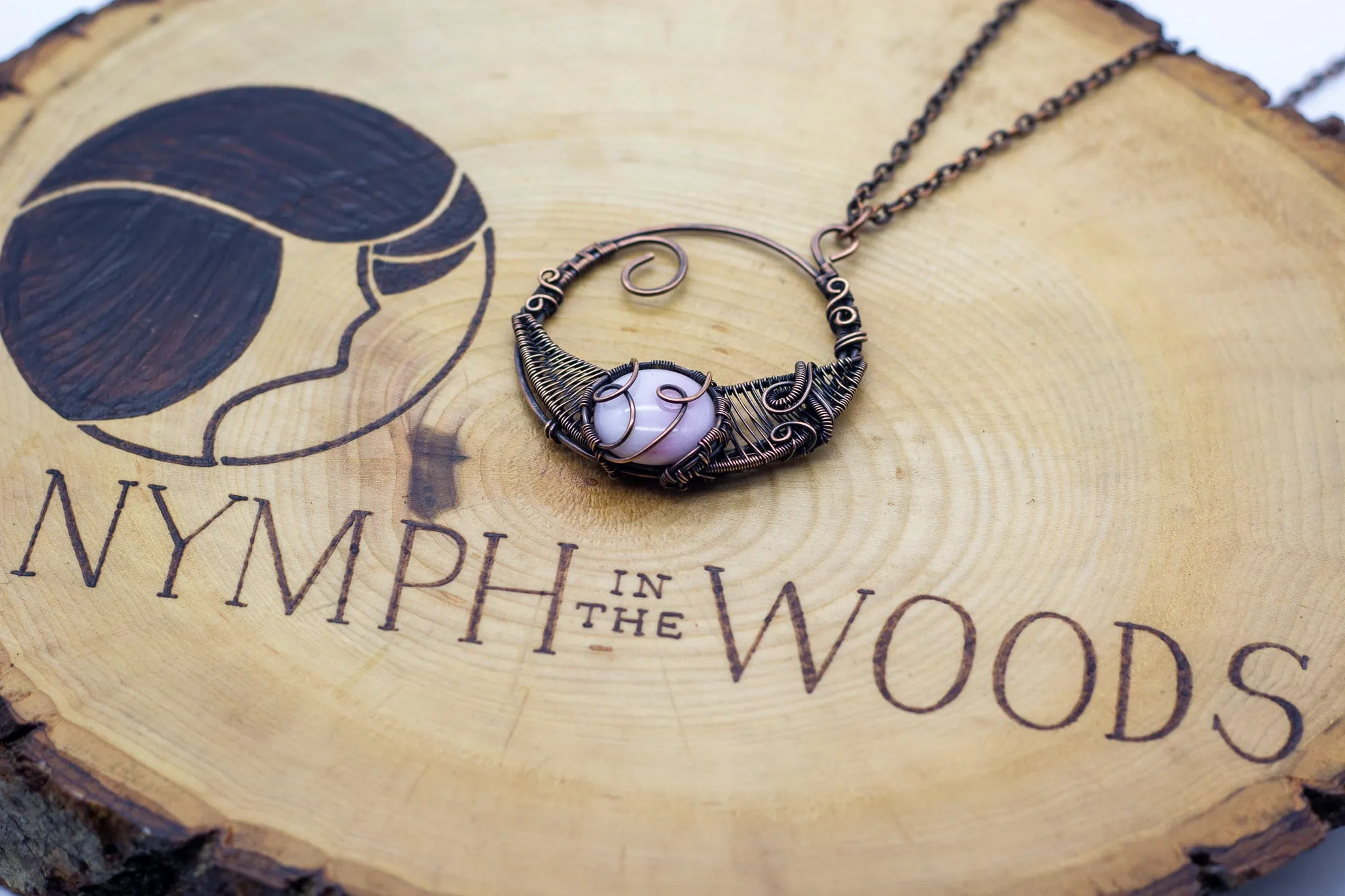 Circular Copper Wire Wrapped Pendant with Light Pink Fused Glass