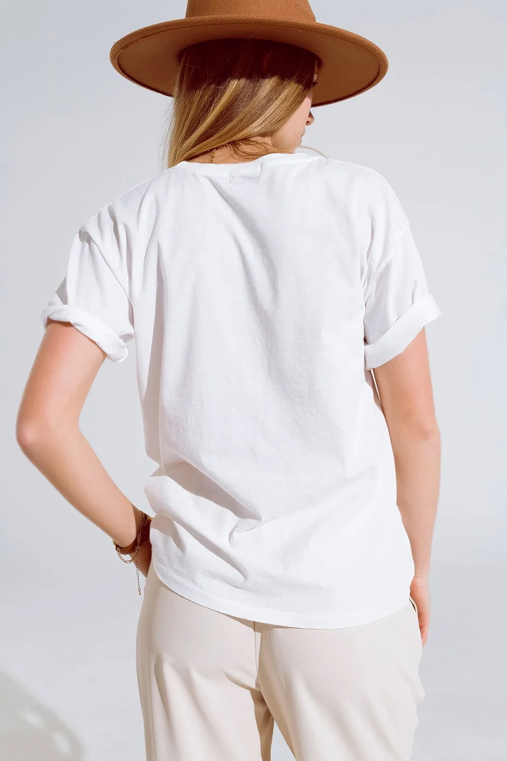 Creme T-shirt With famous Names Logos At The Front