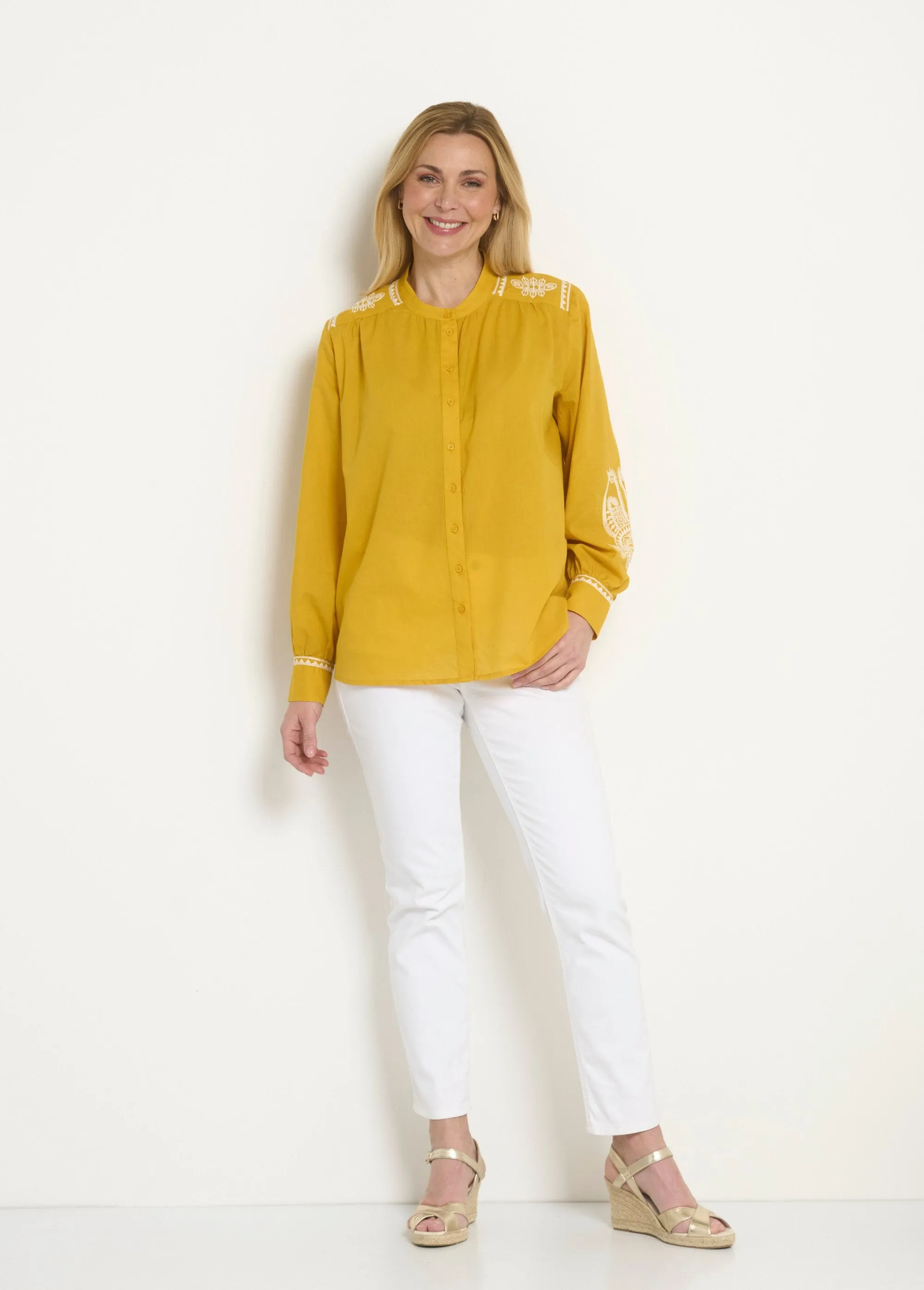 Loose blouse with contrasting embroidery