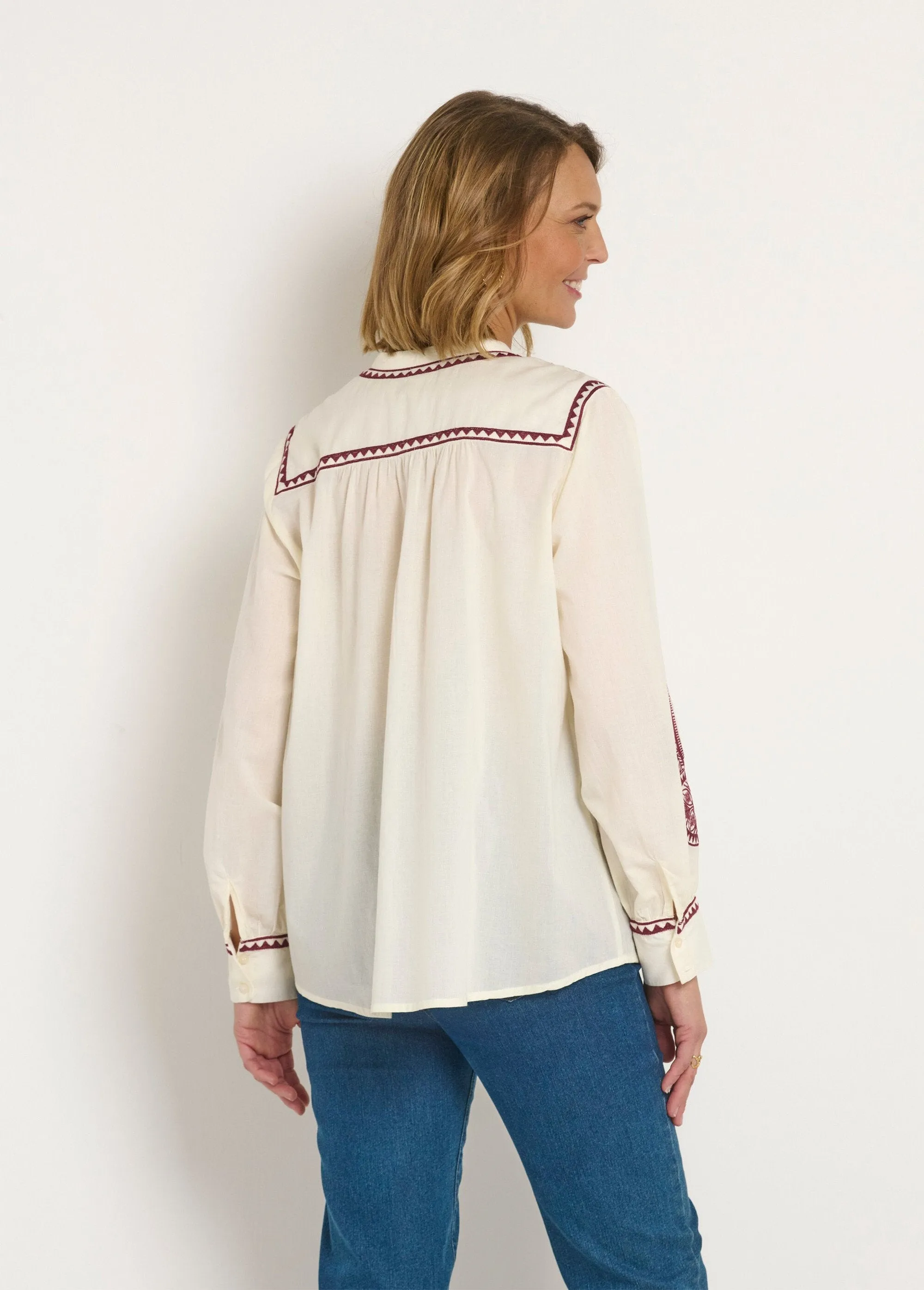Loose blouse with contrasting embroidery