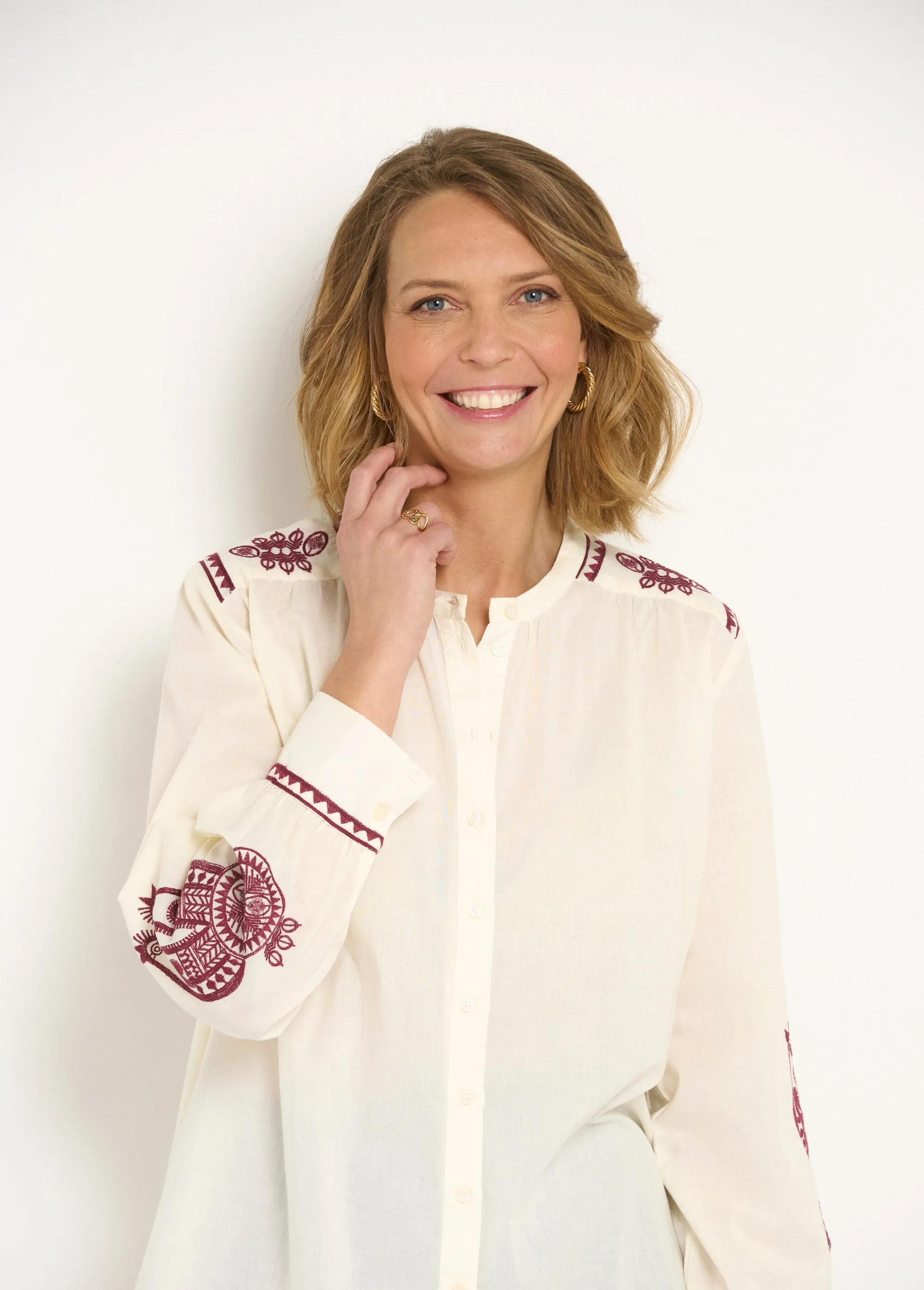 Loose blouse with contrasting embroidery