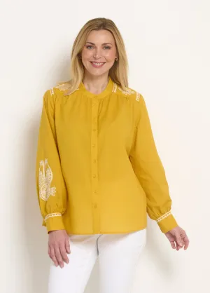 Loose blouse with contrasting embroidery