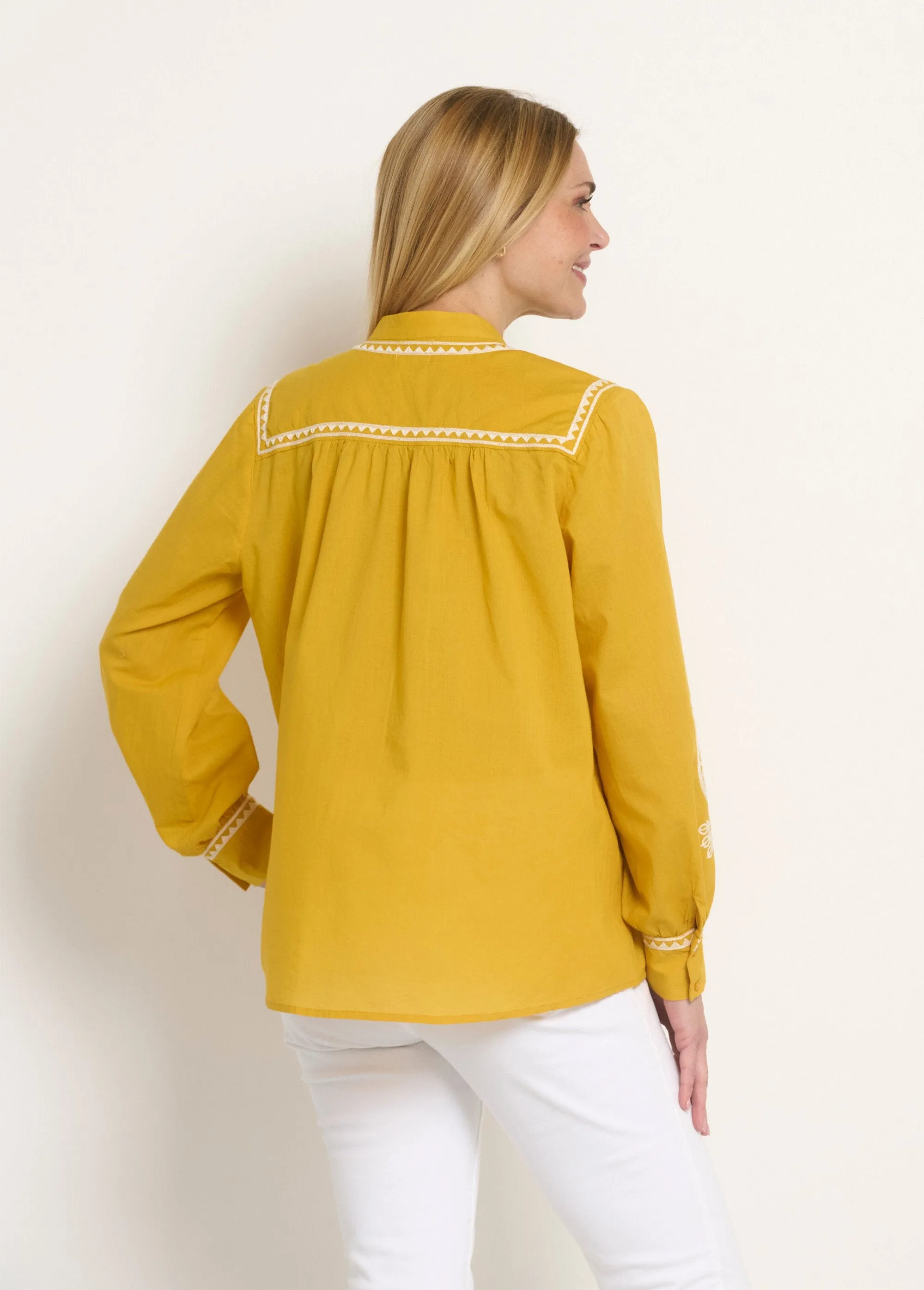 Loose blouse with contrasting embroidery