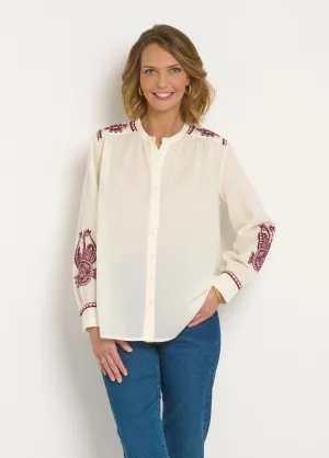 Loose blouse with contrasting embroidery