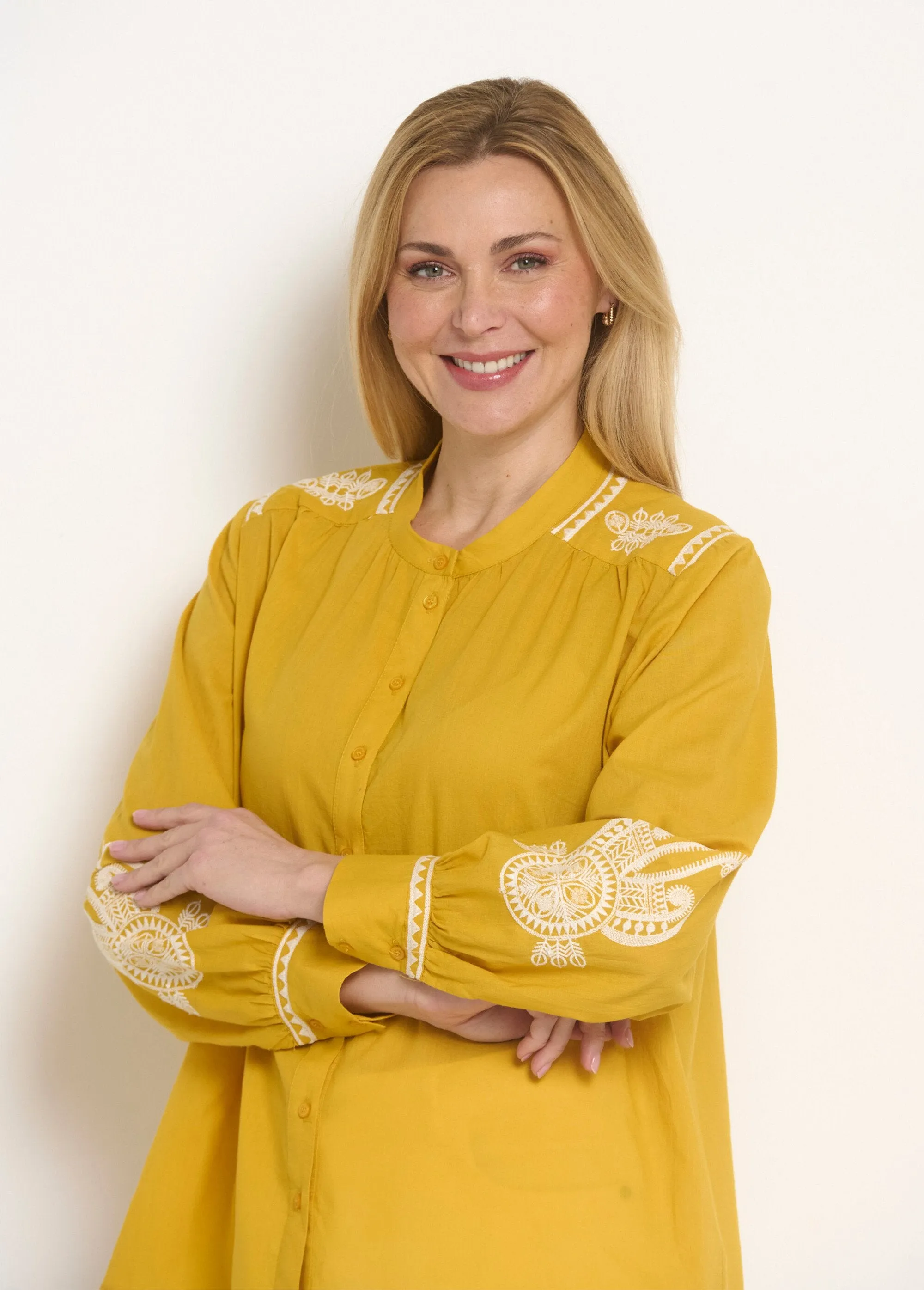 Loose blouse with contrasting embroidery