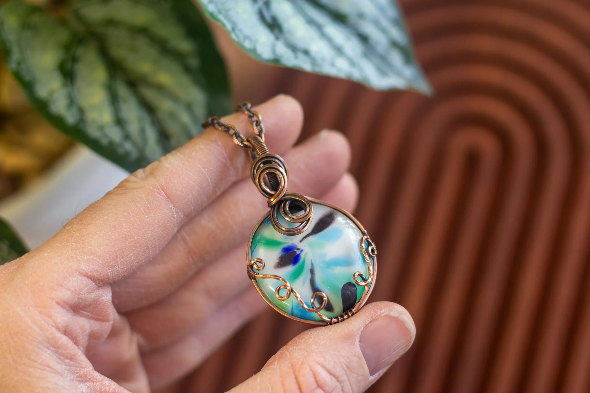 Streaked Green, Blue, and Black Fused Glass Pendant with Copper Wire Wrapping