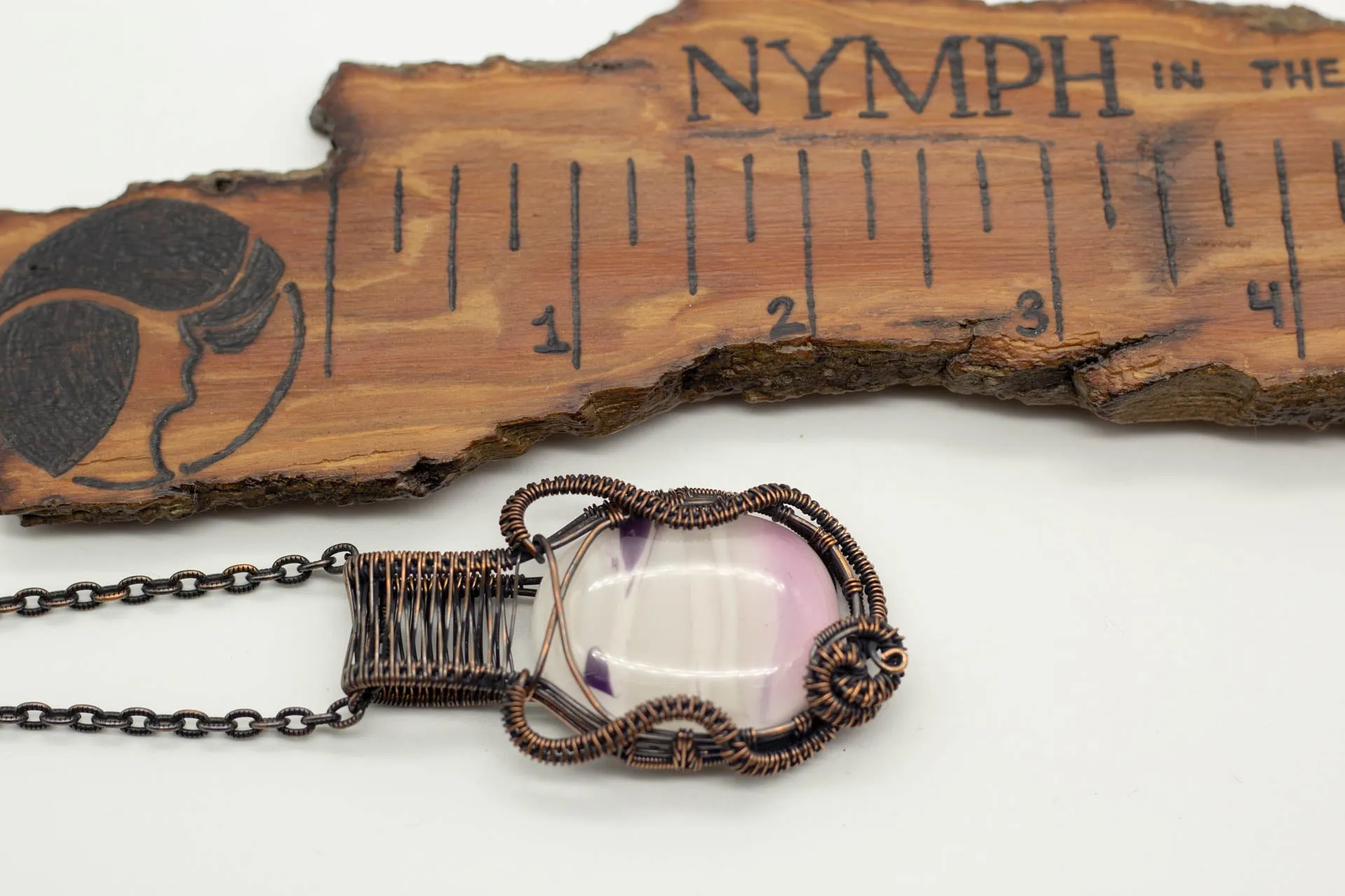 Streaked Pink and Cream Fused Glass Pendant with Copper Wire Wrapping