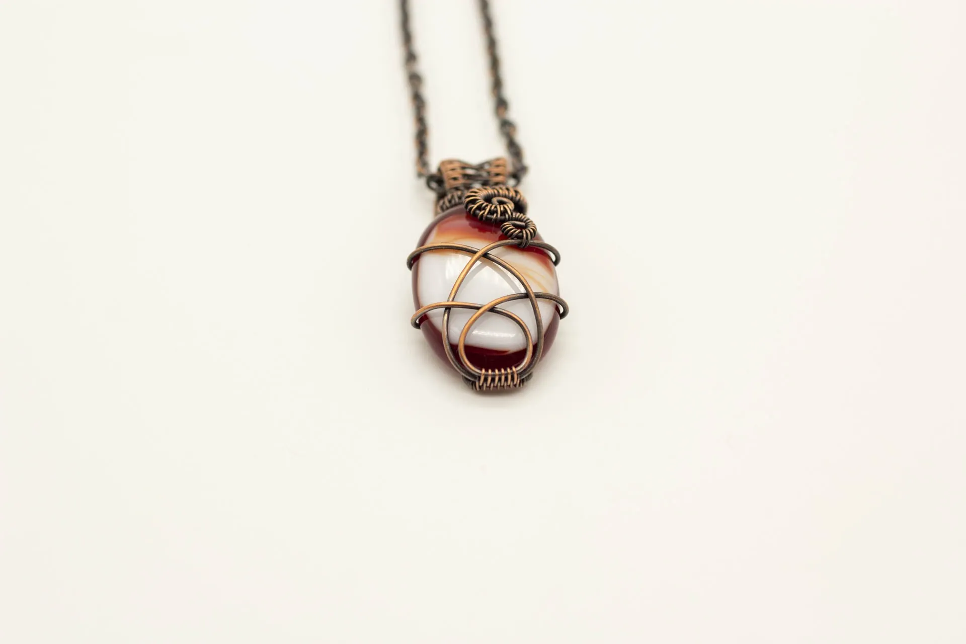 Streaked Red and White Oval Fused Glass Pendant with Copper Wire Wrapping